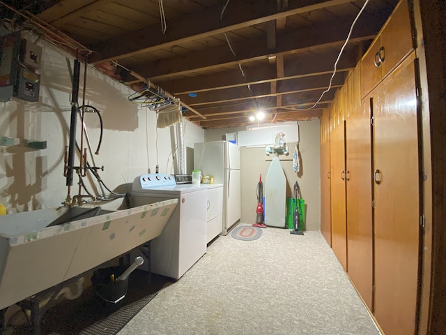 laundry area featuring laundry area, light colored carpet, and washing machine and dryer