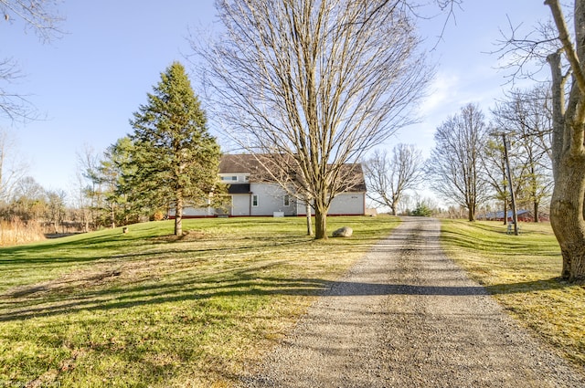 view of street featuring gravel driveway