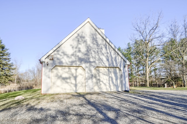view of property exterior featuring a detached garage