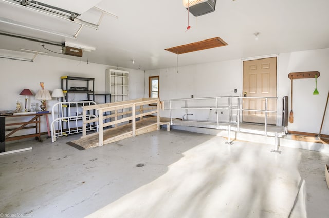 garage featuring a garage door opener