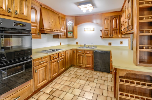 kitchen featuring a sink, custom exhaust hood, brown cabinetry, light countertops, and black appliances