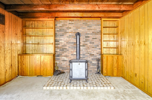 interior space with wood ceiling, wooden walls, carpet flooring, and beamed ceiling