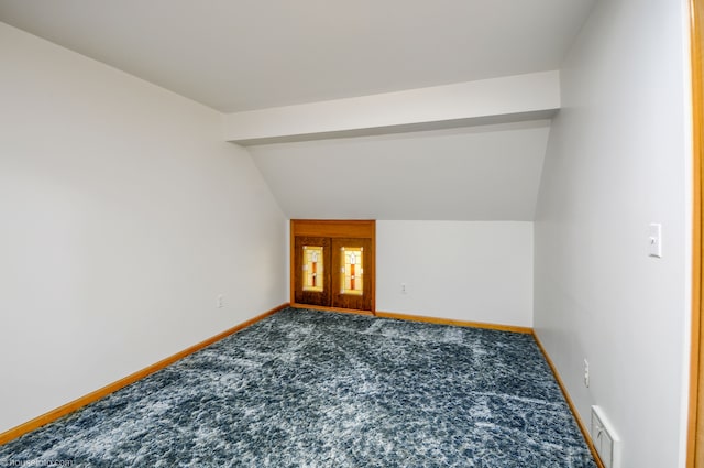 bonus room with baseboards, vaulted ceiling, visible vents, and carpet floors