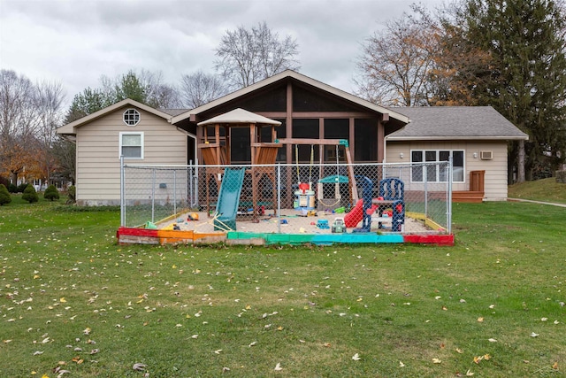 rear view of property with a yard