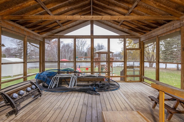 sunroom / solarium featuring a water view and a wealth of natural light