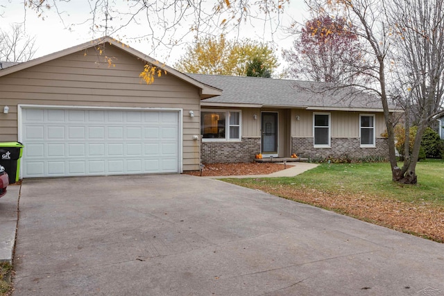 single story home featuring a front yard, a shingled roof, an attached garage, brick siding, and driveway
