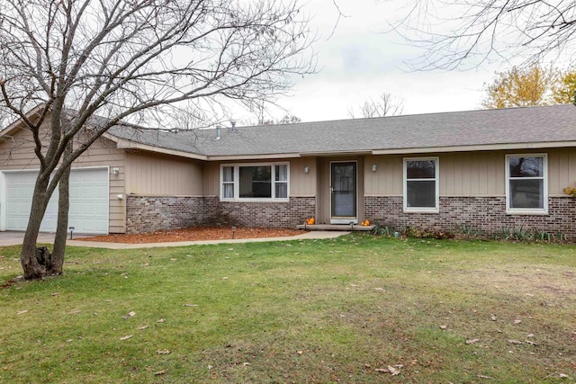 ranch-style home featuring brick siding, a front lawn, and a garage
