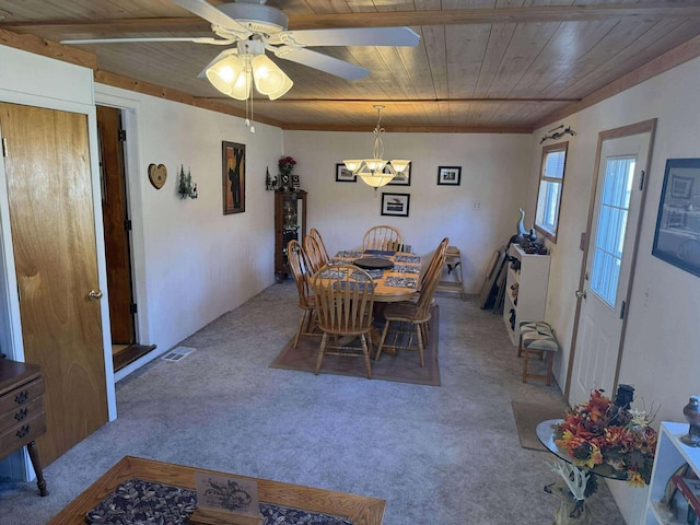 18175 Lake Dr, Big Rapids, MI 49307 - dining area with wood ceiling, ceiling fan with notable chandelier, carpet flooring, and visible vents