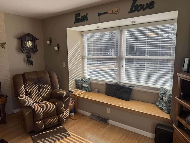 18175 Lake Dr, Big Rapids, MI 49307 - living area with light wood-style floors, baseboards, and visible vents