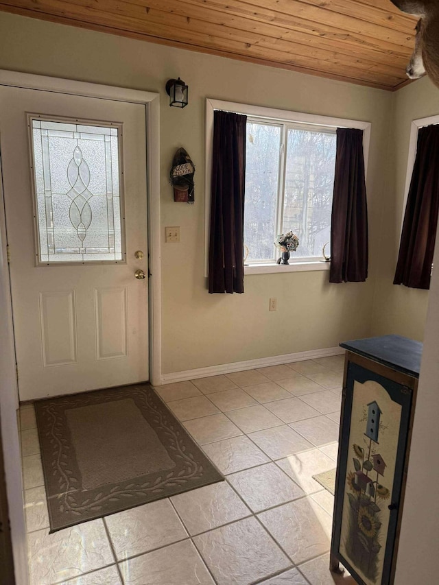 18175 Lake Dr, Big Rapids, MI 49307 - foyer featuring wood ceiling, baseboards, and light tile patterned flooring