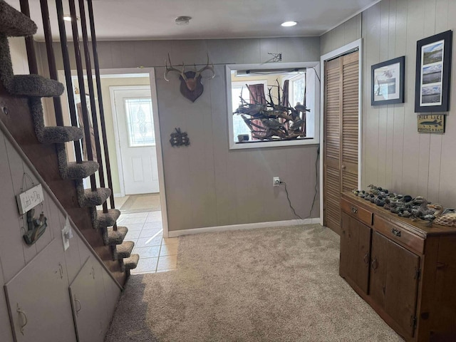 18175 Lake Dr, Big Rapids, MI 49307 - interior space with light colored carpet, baseboards, and stairs