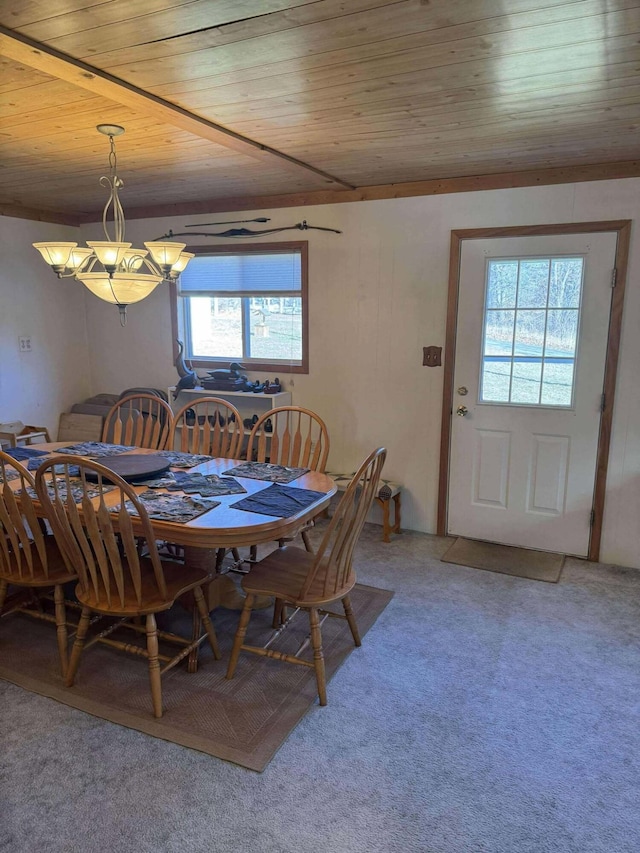 18175 Lake Dr, Big Rapids, MI 49307 - dining space with wooden ceiling, light colored carpet, and an inviting chandelier