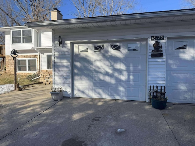 18175 Lake Dr, Big Rapids, MI 49307 - garage featuring aphalt driveway