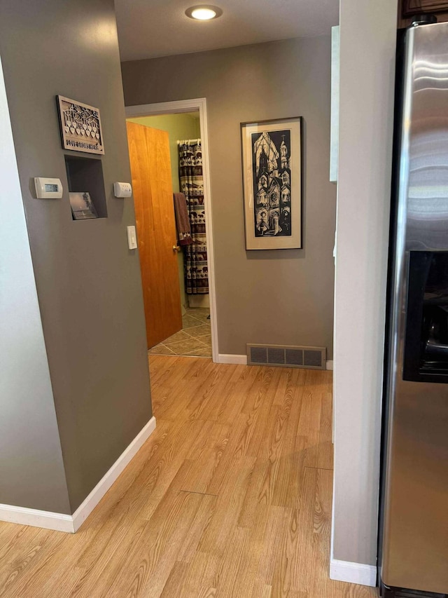 18175 Lake Dr, Big Rapids, MI 49307 - hallway with light wood-style flooring, baseboards, visible vents, and recessed lighting