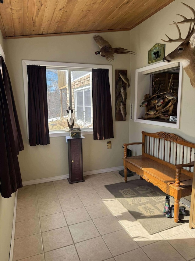 18175 Lake Dr, Big Rapids, MI 49307 - interior space featuring wooden ceiling, light tile patterned floors, and ornamental molding