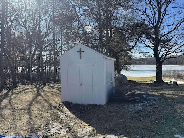18175 Lake Dr, Big Rapids, MI 49307 - view of shed featuring a water view