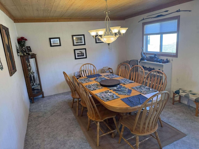 18175 Lake Dr, Big Rapids, MI 49307 - dining area featuring a chandelier, wood ceiling, wooden walls, and carpet