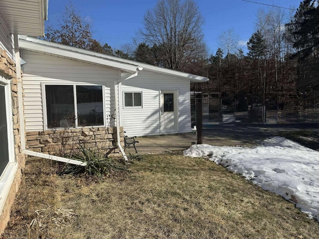 18175 Lake Dr, Big Rapids, MI 49307 - view of property exterior with a patio area