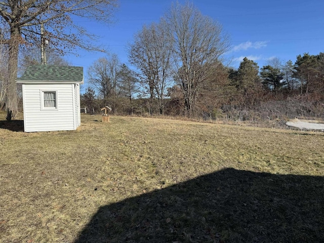 18175 Lake Dr, Big Rapids, MI 49307 - view of yard featuring an outbuilding and a storage unit