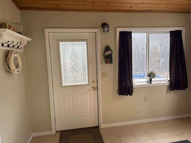 18175 Lake Dr, Big Rapids, MI 49307 - doorway to outside featuring plenty of natural light, light tile patterned floors, baseboards, and wooden ceiling