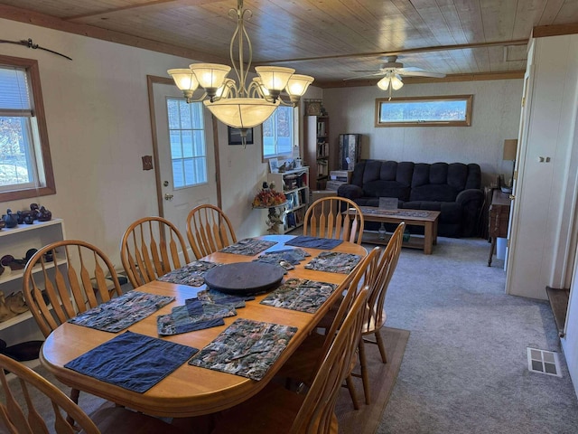 18175 Lake Dr, Big Rapids, MI 49307 - carpeted dining room featuring wood ceiling, ceiling fan with notable chandelier, and visible vents