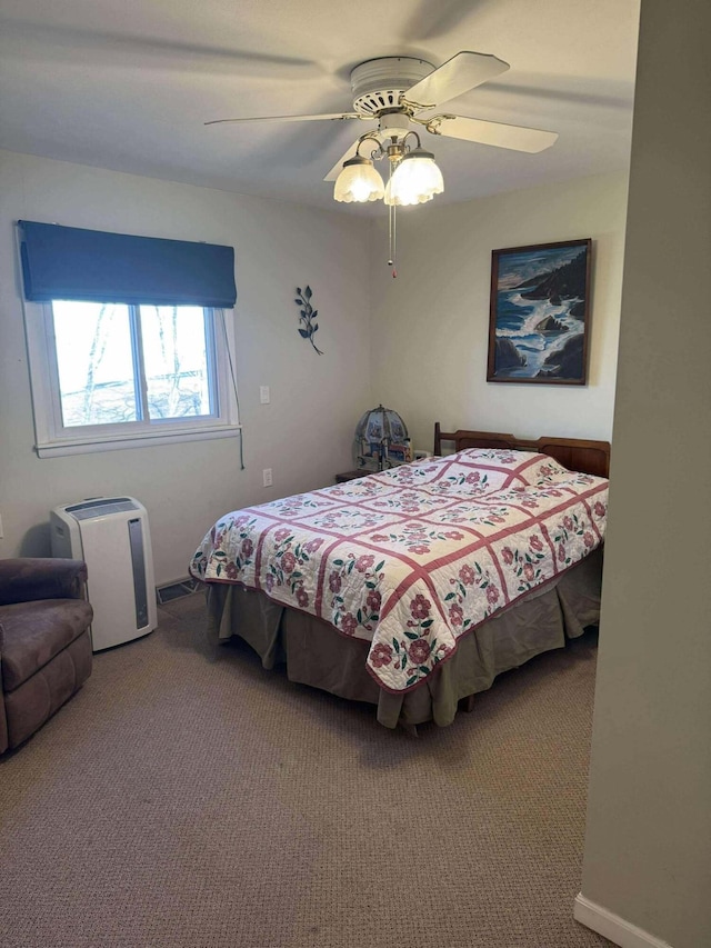 18175 Lake Dr, Big Rapids, MI 49307 - carpeted bedroom with a ceiling fan