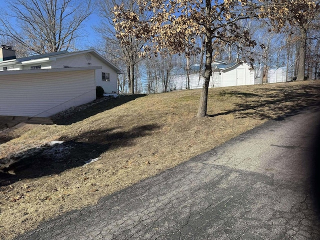 18175 Lake Dr, Big Rapids, MI 49307 - view of yard with a storage shed and an outdoor structure