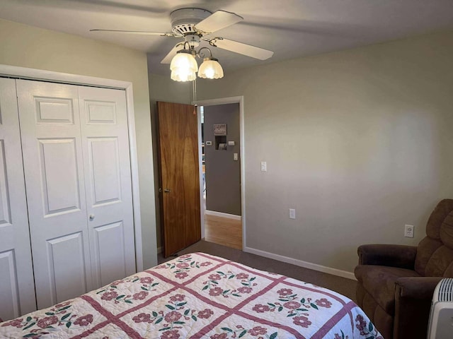 18175 Lake Dr, Big Rapids, MI 49307 - bedroom with dark carpet, a closet, ceiling fan, and baseboards