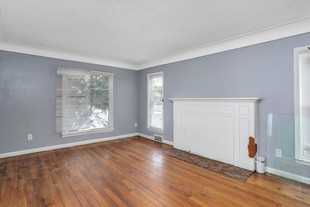11248 Kennebec, Detroit, MI 48205 - unfurnished living room with baseboards, hardwood / wood-style flooring, and visible vents