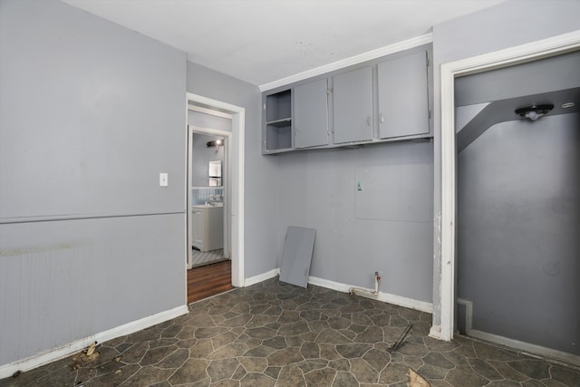 11248 Kennebec, Detroit, MI 48205 - laundry room featuring baseboards and stone floors