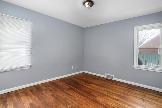 11248 Kennebec, Detroit, MI 48205 - empty room with visible vents, baseboards, and hardwood / wood-style floors