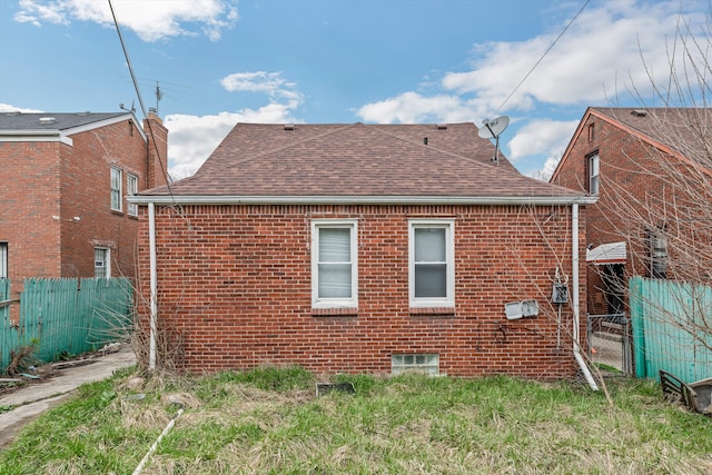 11248 Kennebec, Detroit, MI 48205 - view of side of property with brick siding, fence, and roof with shingles
