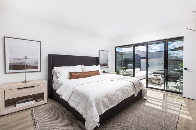 533 E Harrison Ave Unit 29, Royal Oak, MI 48067 - bedroom with access to outside and wood finished floors