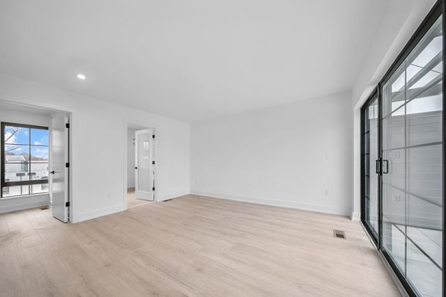 533 E Harrison Ave Unit 29, Royal Oak, MI 48067 - spare room featuring recessed lighting, baseboards, visible vents, and light wood-type flooring