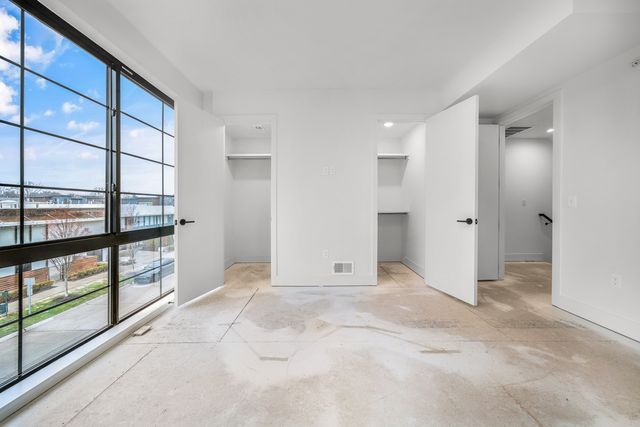 533 E Harrison Ave Unit 29, Royal Oak, MI 48067 - unfurnished bedroom with visible vents and baseboards