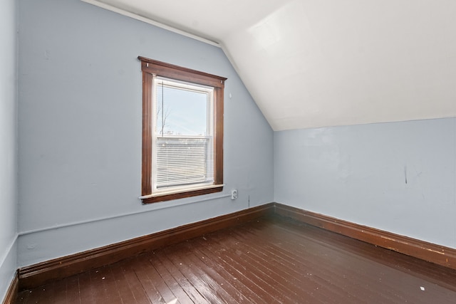 bonus room with baseboards, hardwood / wood-style floors, and vaulted ceiling