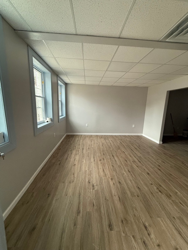 2651 Neibel St, Hamtramck, MI 48212 - spare room featuring a paneled ceiling, wood finished floors, and baseboards
