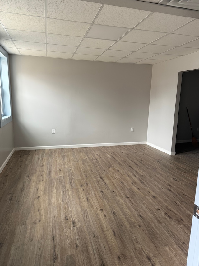 2651 Neibel St, Hamtramck, MI 48212 - spare room featuring a paneled ceiling, baseboards, and wood finished floors