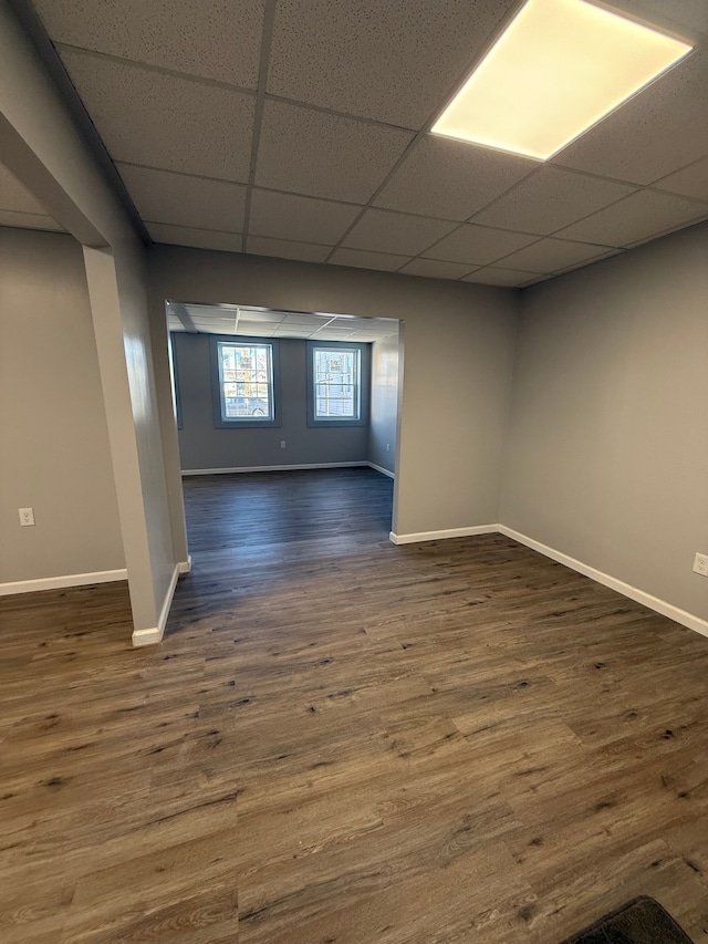 2651 Neibel St, Hamtramck, MI 48212 - unfurnished room with a paneled ceiling, baseboards, and dark wood finished floors