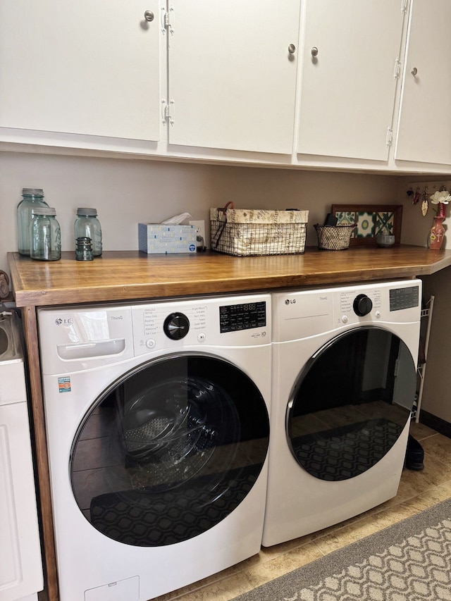 12131 Brandywine Dr, Brighton, MI 48114 - washroom with washer and clothes dryer and cabinet space