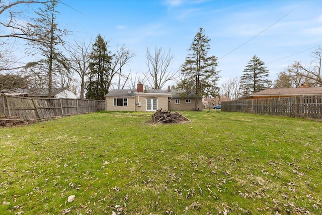 view of yard featuring a fenced backyard