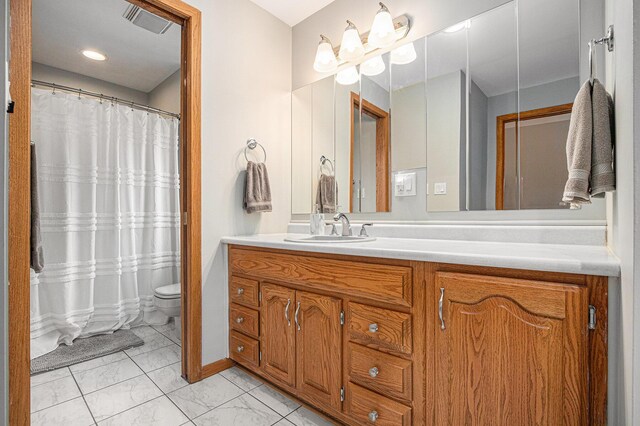 3804 Lincoln Ave, Saint Joseph, MI 49085 - full bathroom with vanity, marble finish floor, visible vents, and toilet