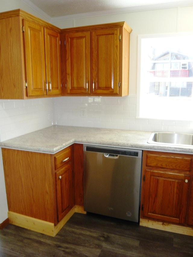 kitchen with tasteful backsplash, dishwasher, light countertops, dark wood finished floors, and brown cabinets