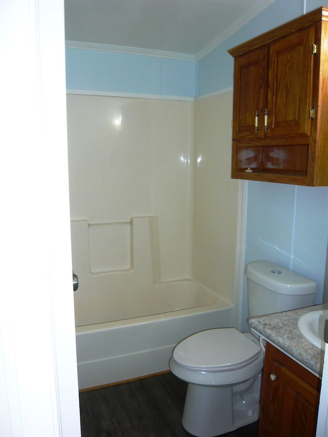 bathroom featuring toilet, wood finished floors, and vanity