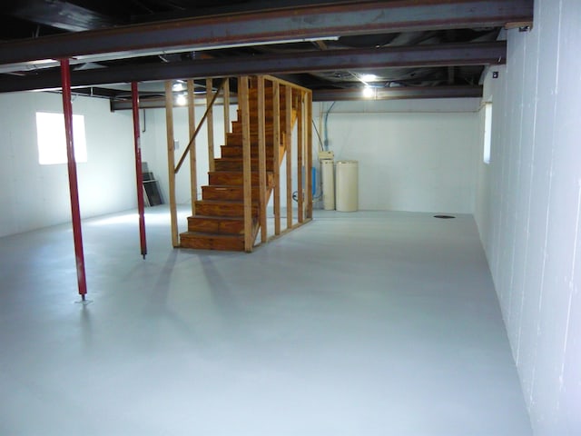 basement featuring stairs