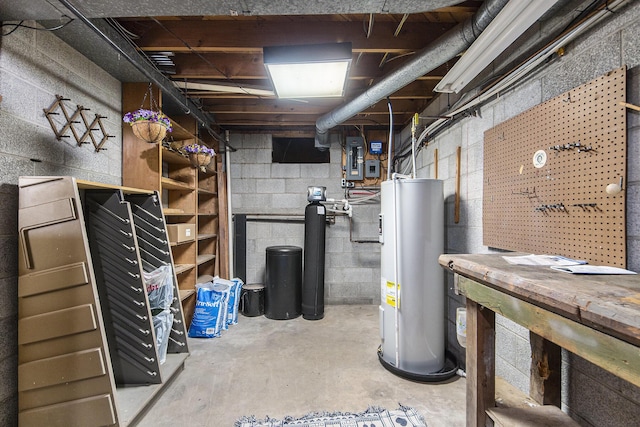 3942 Harmon Dr, Fremont, MI 49412 - unfinished below grade area featuring water heater, a workshop area, and concrete block wall
