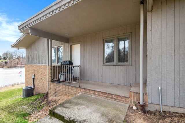 3942 Harmon Dr, Fremont, MI 49412 - property entrance featuring central air condition unit