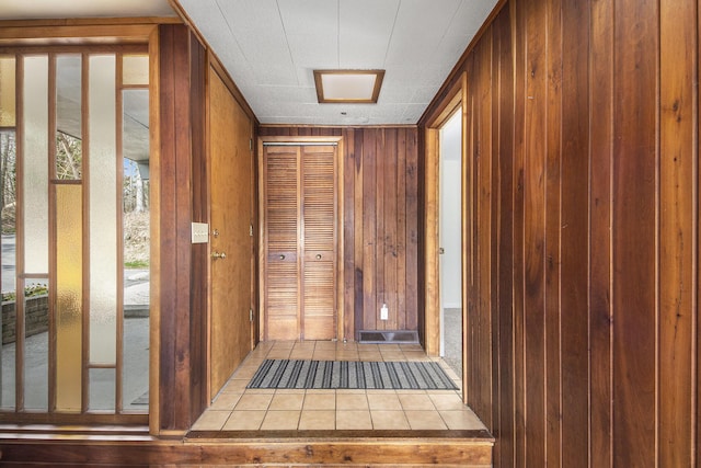3942 Harmon Dr, Fremont, MI 49412 - interior space with wooden walls and light tile patterned floors