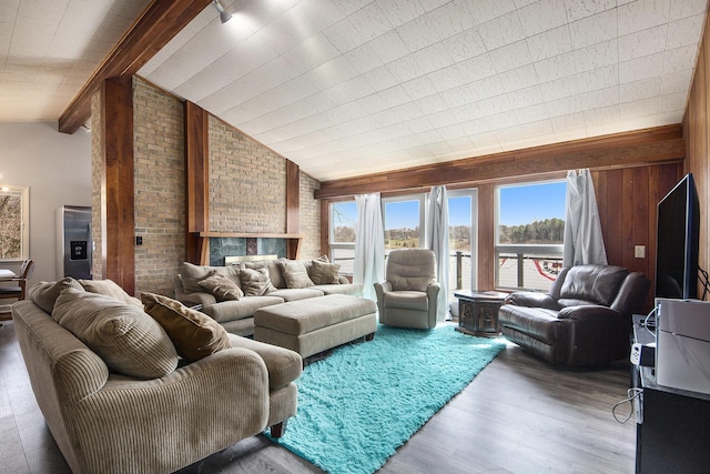 3942 Harmon Dr, Fremont, MI 49412 - living area with wood finished floors, wooden walls, and vaulted ceiling with beams
