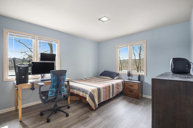 3942 Harmon Dr, Fremont, MI 49412 - bedroom with baseboards and wood finished floors